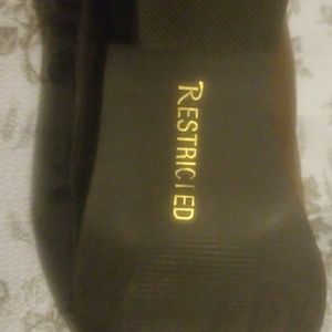 Restricted brown boot.